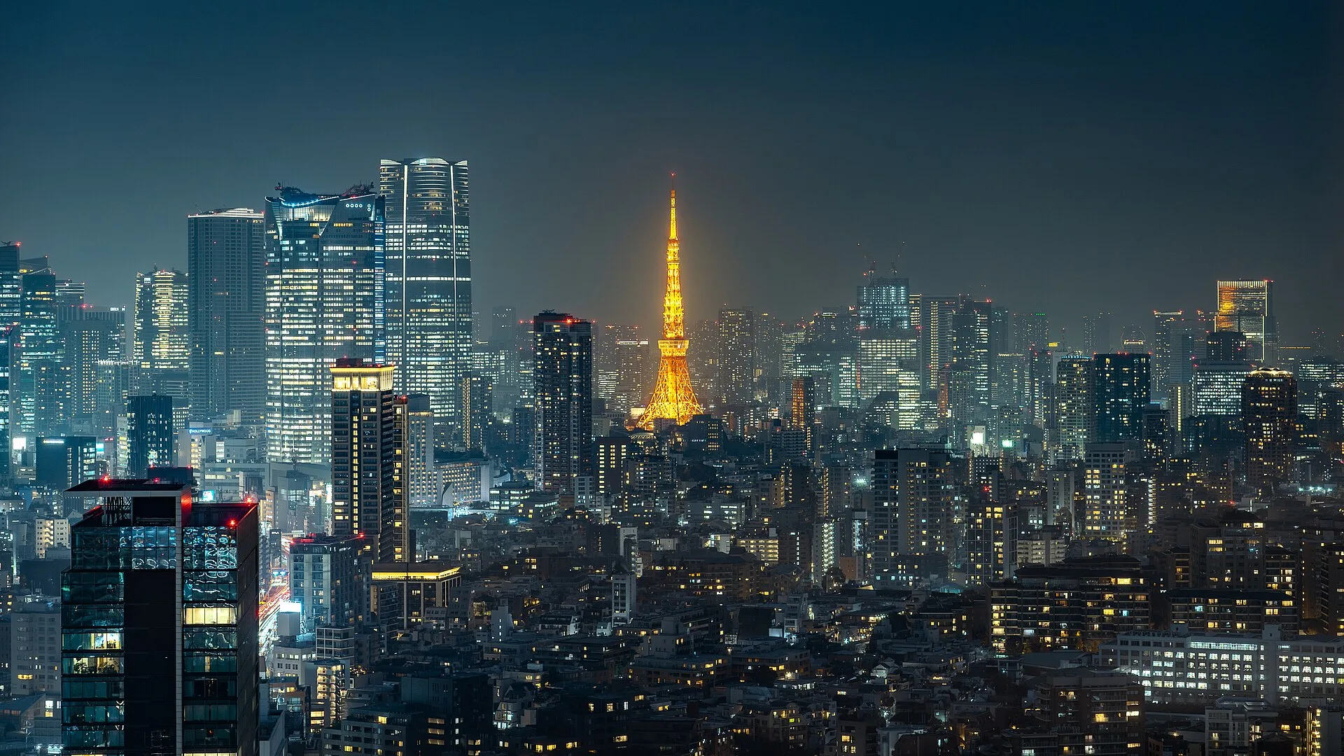 Tokyo Tower night skyline as Nikkei surges while ASX and Sensex fall