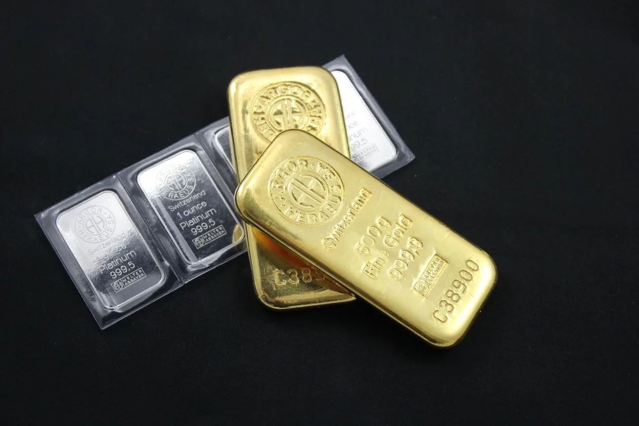 Gold and platinum bars as gold price rebounds to $4,159 on cooling yields