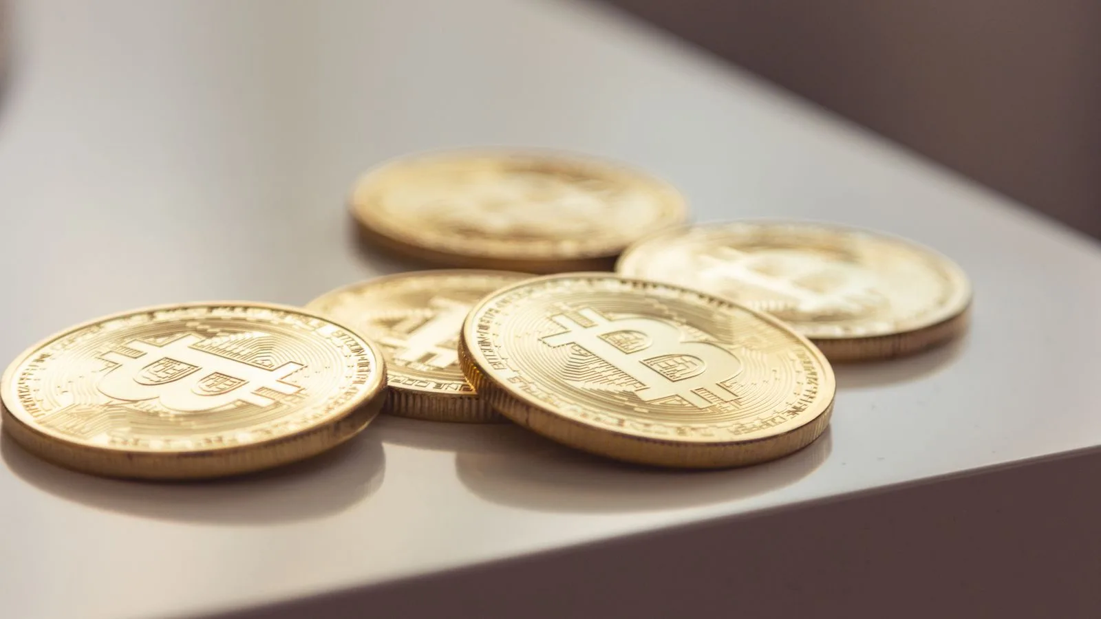 Gold Bitcoin coins close-up as Bitcoin nears $87K eight-month high